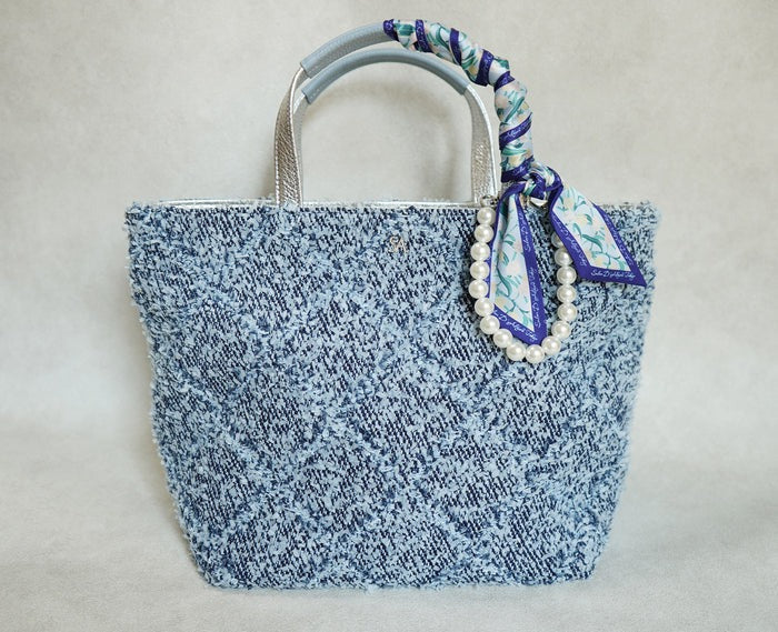 The scarf and charm are sold separately.