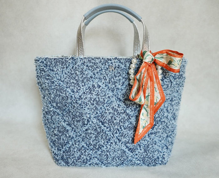 The scarf and charm are sold separately.